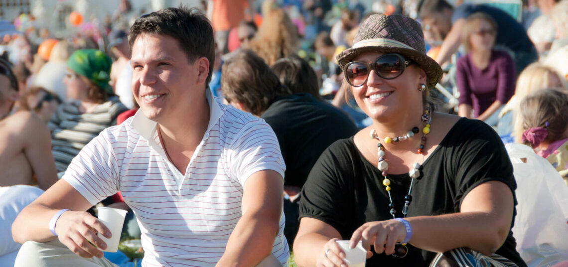 Two people sitting at show